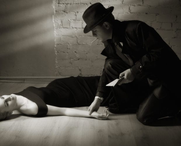 Detective investigating the crime scene