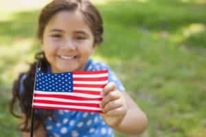 Little girl holding the American flag