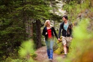 Couple taking romantic walk in the woods