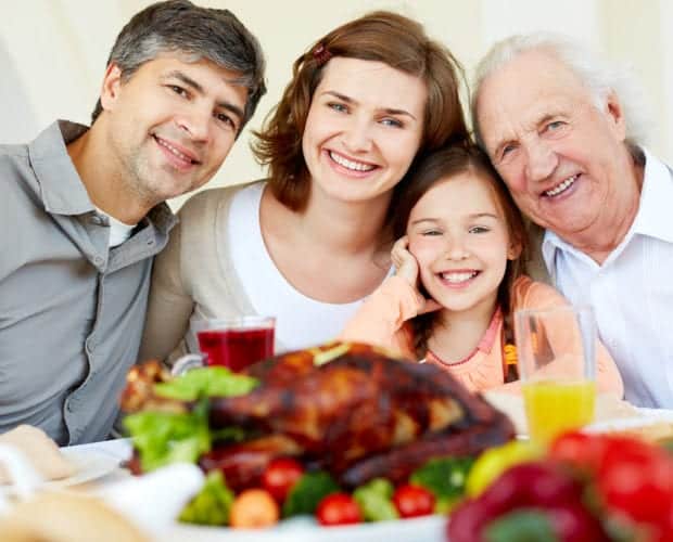 Happy family at Thanksgiving table