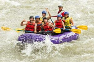 Family white water rafting in the Smoky Mountains through a Pigeon Forge hotel deal