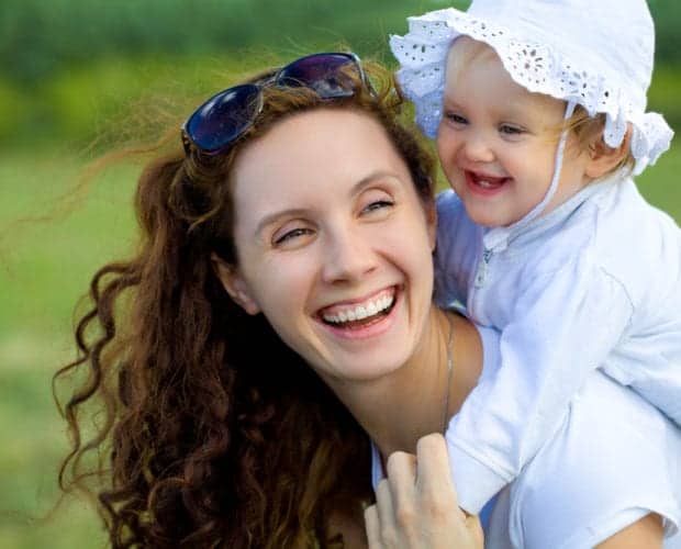 Happy woman and baby outside of our hotel in Pigeon Forge.