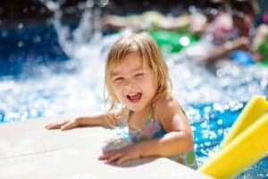 Little girl enjoying the swimming pool near our Pigeon Forge hotel suites.
