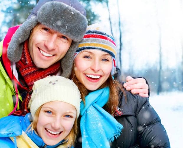 A happy family enjoying a snowy day near our hotel in the Smoky Mountains.