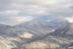 A scenic photograph of the Smoky Mountains covered in snow.