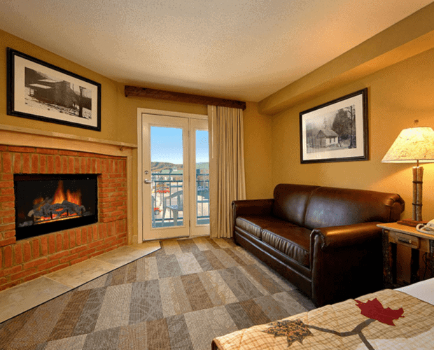 A suite with a leather couch and a toasty fireplace at our hotel in the Smoky Mountains.