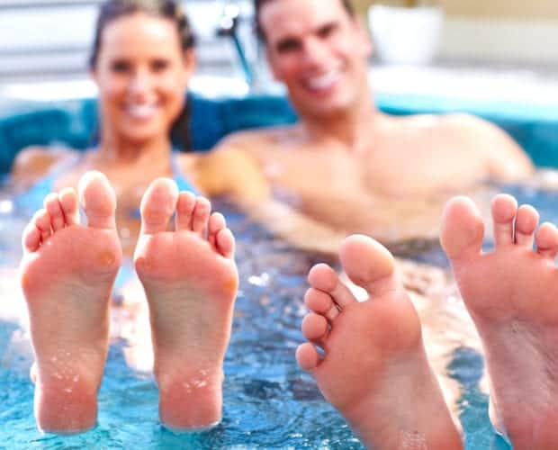Happy couple at our Pigeon Forge hotel with Jacuzzi in room.