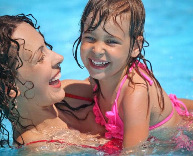 Mother and daughter swimming in the pool at our Pigeon Forge Tennessee hotel.