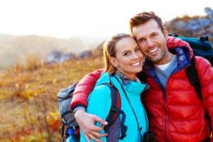 Young couple smiling in the mountains